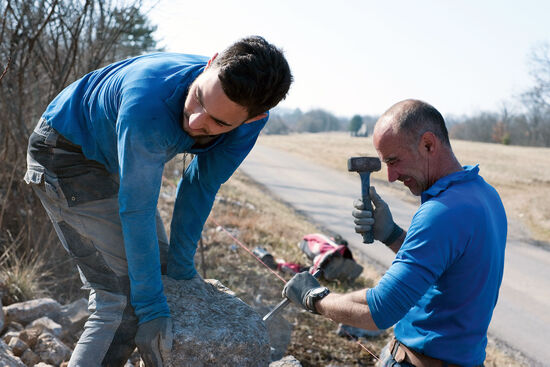 Stonemason Mitja Kobal and his son Dane building a drystone wall in the village of Kosovelje, Slovenia (photo © Rudolf Abraham).