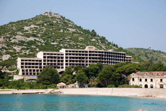 The empty shell of the Hotel Kupari, in the Croatian resort of the same name, dwarfs its predecessor, the Grand Hotel, seen at the bottom right of the picture (photo © Duncan JD Smith).